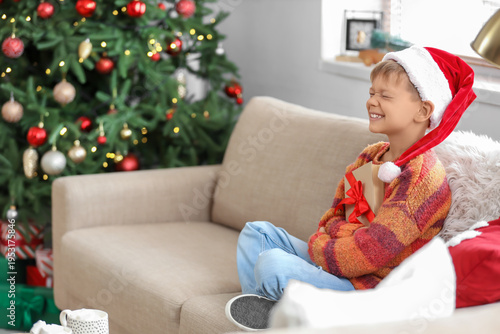 Cute little boy in Santa ha...