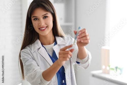 Female doctor with lancet pen in clinic