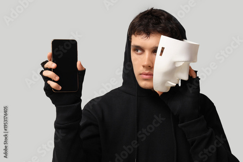 Male fraudster with mask an...