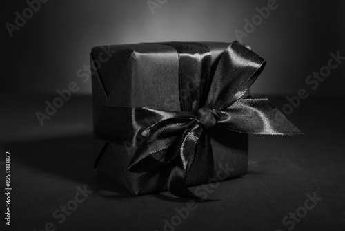 Black gift box on dark back...