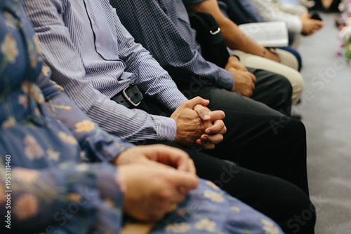 Obraz na plátně People praying together during a church service