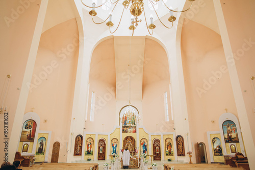 Tableau sur toile Priest performing religious ceremony inside christian church
