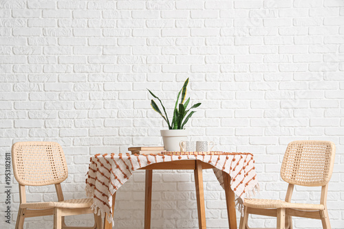 Chairs and table near white...