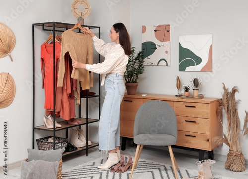 Young woman with stylish sw...