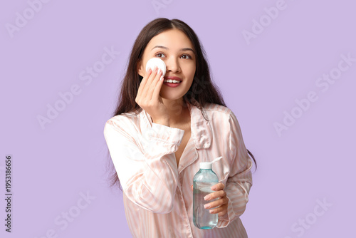 Young Asian woman in pajama...