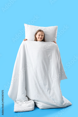 Little girl with pillow and...