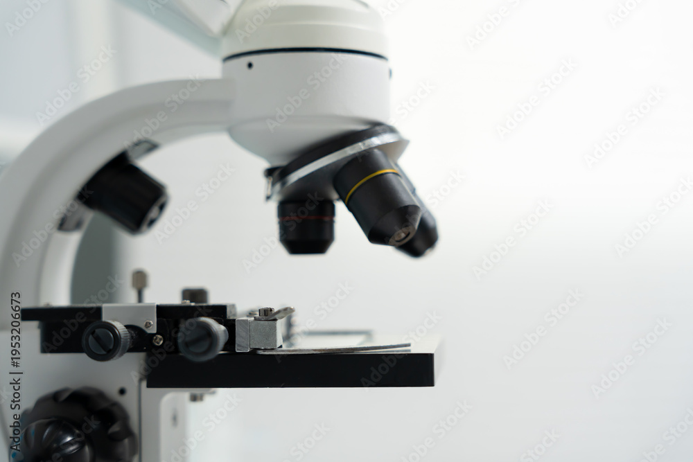 Fototapeta premium Scientist analyze biochemical samples in advanced scientific laboratory. Medical professional use microscope look microbiological developmental of viral. Biotechnology research in science lab.