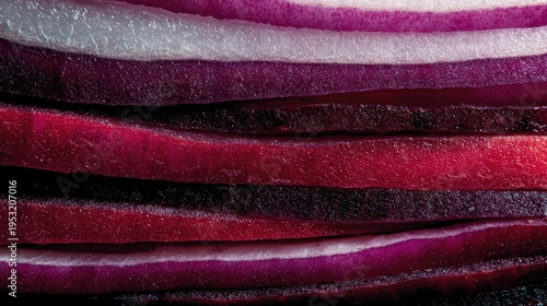 Close-up of red onion layers with deep red and purple hues isolated white