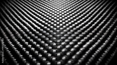 A close-up view of a sleek carbon fiber texture pattern