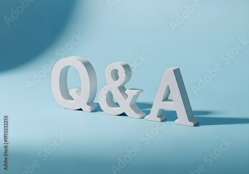 White wooden letters forming the q and a abbreviation isolated on a soft blue background surface