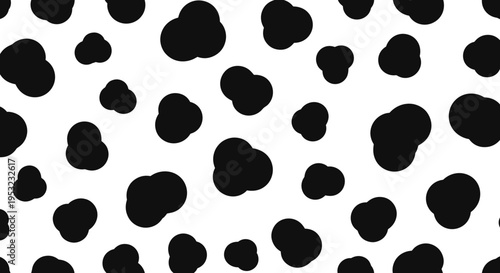 A black and white spotted pattern design on a seamless background