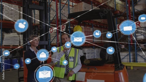 Two coworkers in depot checking docs, blue envelope appearing, icons overlaying scene mapping stock