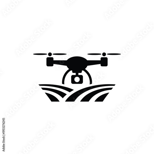A black silhouette of a drone flying over a field of crops