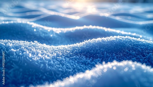 Close-up of pristine snow, illuminated by sunlight. Fluffy, icy crystals create undulating shapes. Focus is on texture and light