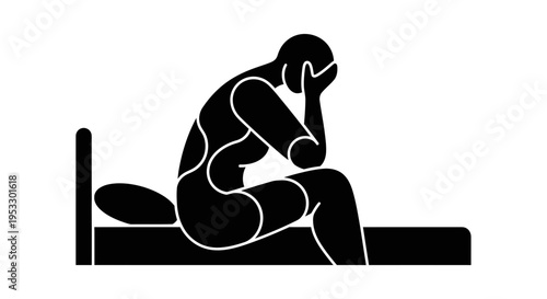 Sad woman sitting on bed.