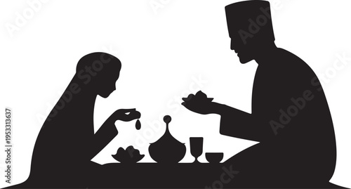 Black silhouette of man and woman sitting at table with tea set
