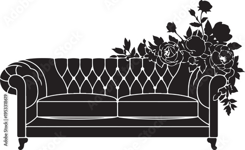 Black tufted sofa with floral arrangement black sofa