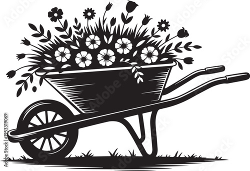 Black wheelbarrow filled with flowers and grass gardening