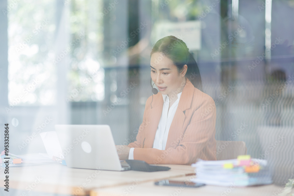 Fototapeta premium Customer Service Representative with Headset Assisting Client in Modern Office