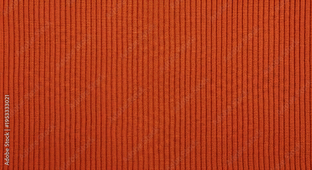 Fototapeta premium A close-up view of an orange fabric with a ribbed texture