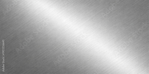 A shiny silver brushed metal texture background with a polished stainless steel surface and industrial gray aluminum plate pattern for a metallic material backdrop
