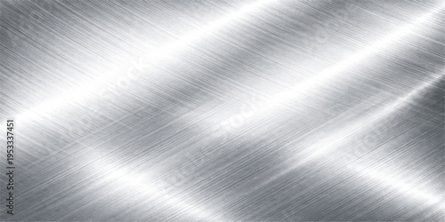 A polished silver stainless steel plate with a brushed metal texture featuring a shiny metallic surface and industrial grey pattern reflection for a sleek material backdrop