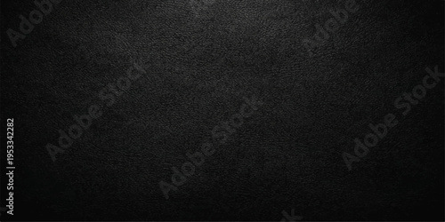 Dark black leather texture with a rough macro pattern on a blank material surface provides a dark fabric backdrop for a textured wallpaper or textile cloth background