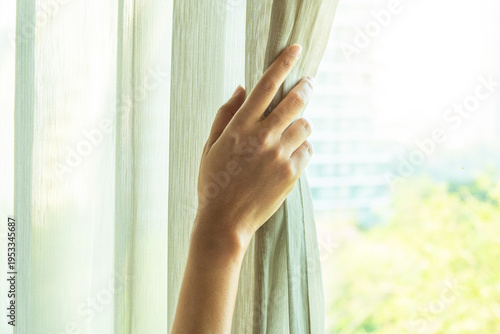 woman's hand She opened the curtains on the window. There was morning light through the window in her room, looking at the view of the mountains and trees as the sun rose Free Download woman's hand She opened the curtains on the window. There was morning light through the window in her room, looking at the view of the mountains and trees as the sun rose - GFXLoad