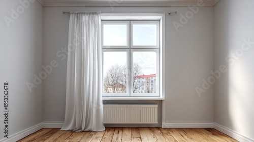 Empty room with a window and white curtains reveals a cityscape view.