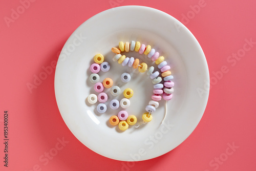 Candy necklace on a white plate