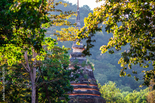 A natural backdrop of twilight sky and beautiful changing sunsets during a trip to Thailand, featuring mountains, rice fields, and temporary huts.
