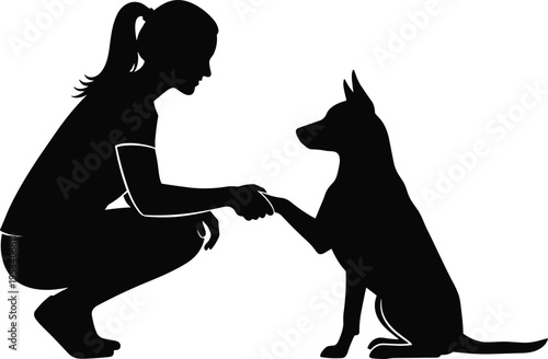 Silhouette of a Woman Crouching and Shaking Hands with a Dog friendship