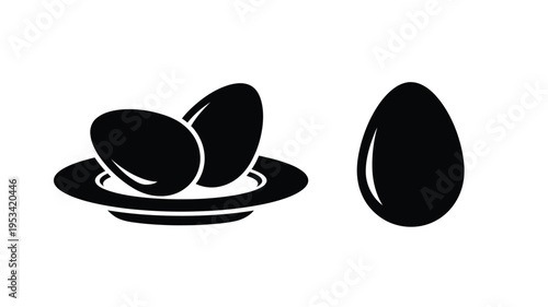 Black eggs displayed on a plate a minimalist graphic silhouette