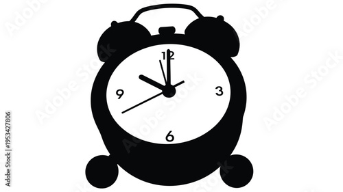 Black alarm clock displaying ten o clock a striking silhouette