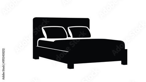 Simple black bed design with two pillows a stark silhouette