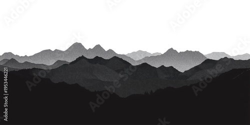 Misty blue mountain range silhouettes during a sunrise morning with fog and clouds covering the forest valley landscape at the horizon