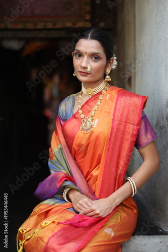 An Indian young woman in a traditional Marathi attire on a Hindu festival. 