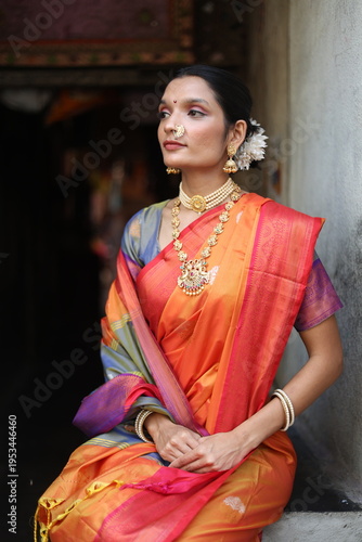 An Indian young woman in a traditional Marathi attire on a Hindu festival. 
