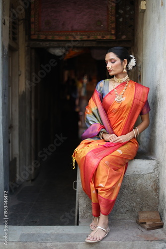 An Indian young woman in a traditional Marathi attire on a Hindu festival. 