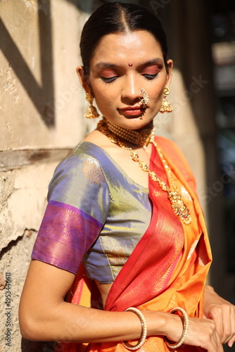 An Indian young woman in a traditional Marathi attire on a Hindu festival. 