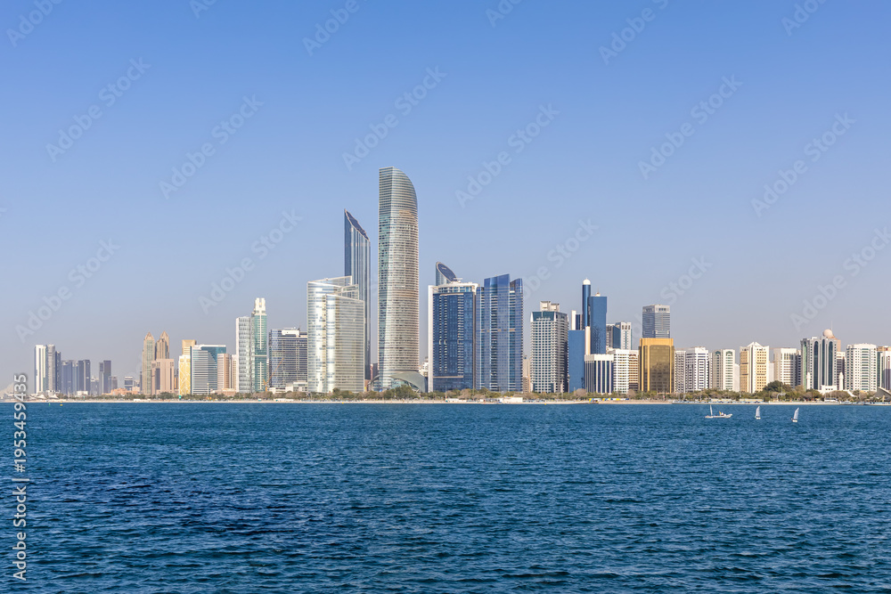 Fototapeta premium Abu Dhabi skyline with skyscrapers at sea in Abu Dhabi, United Arab Emirates