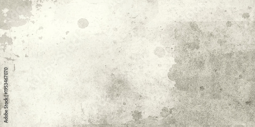 A vintage grey grunge wall texture background features a rough, dirty concrete surface with an old paint pattern and a blank cement backdrop for retro art design