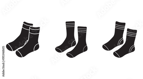 Set of three pairs of black socks with white stripes on white background  foot wear  socks