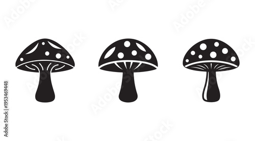 Three black and white mushroom icons with spots on caps and stems isolated on white background
