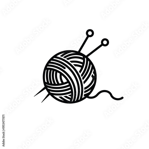 A ball of yarn with knitting needles on a plain surface