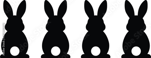 A minimalist set of four black silhouette bunny icons isolated on a clean white background design