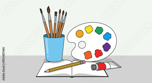 Colorful paint palette and art supplies.