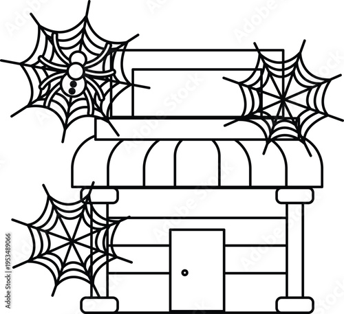 Spooky cobwebs cling to a weathered shopfront