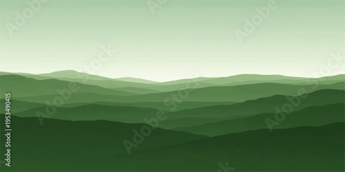 Mountain landscape with clouds and fog over green hills and forest under a bright morning sky