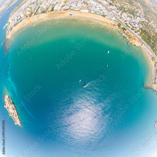 Wallpaper Mural Kizkalesi, Mersin, Turkey. Top-down aerial view of turquoise Mediterranean Sea with Maiden Castle island fortress and golden sandy beaches visible around frame edges. Aerial view Torontodigital.ca
